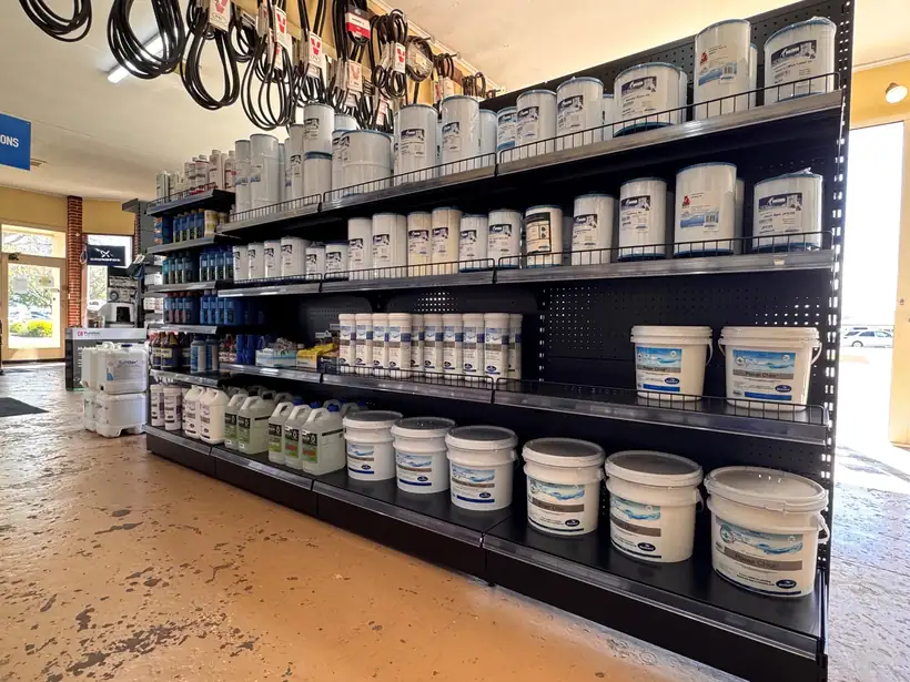 Shelves of pool chemicals in the Ag Worx shop