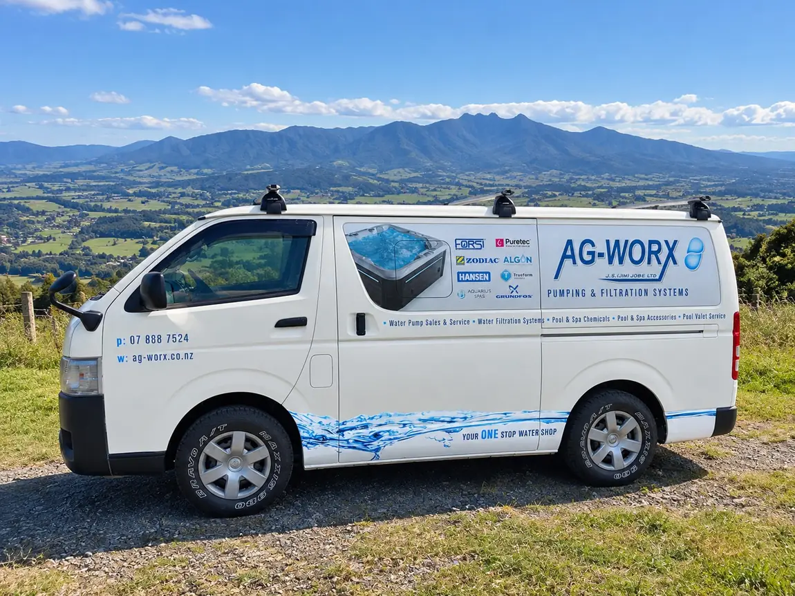 The Ag Worx service van parked above the Waikato plains, with the Kaimai range behind